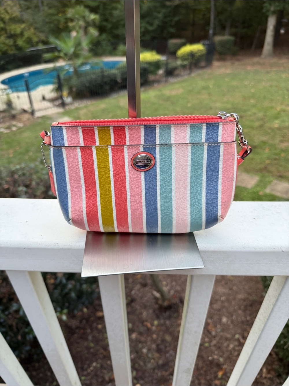 Coach Striped Mini Wristlet in Pink, Blue, Yellow
Good to Fair condition